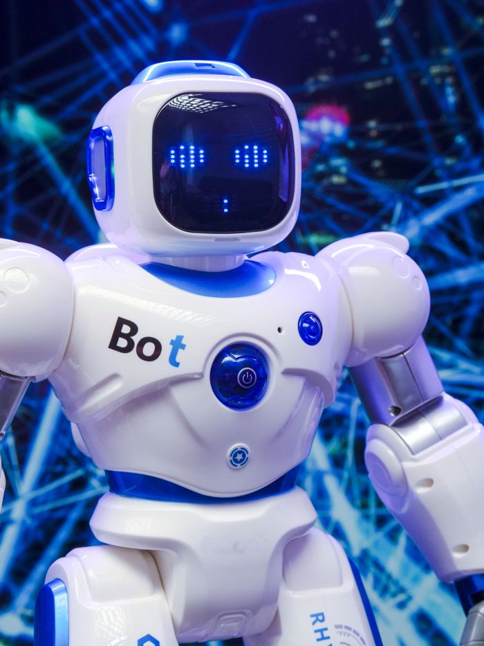 services-04 A humanoid robot with advanced blue LED eyes and sleek white design.